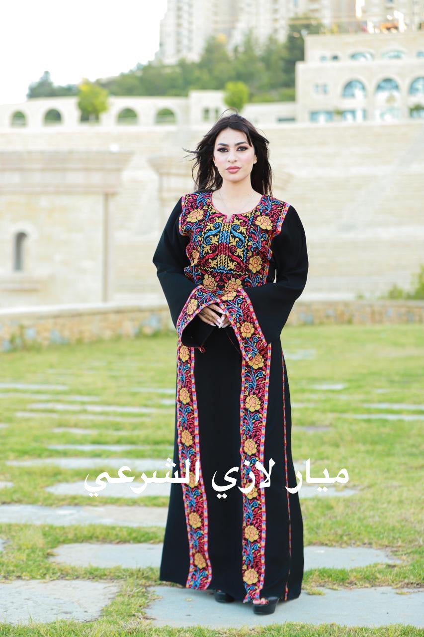Black thobe with colorful tatreez details.