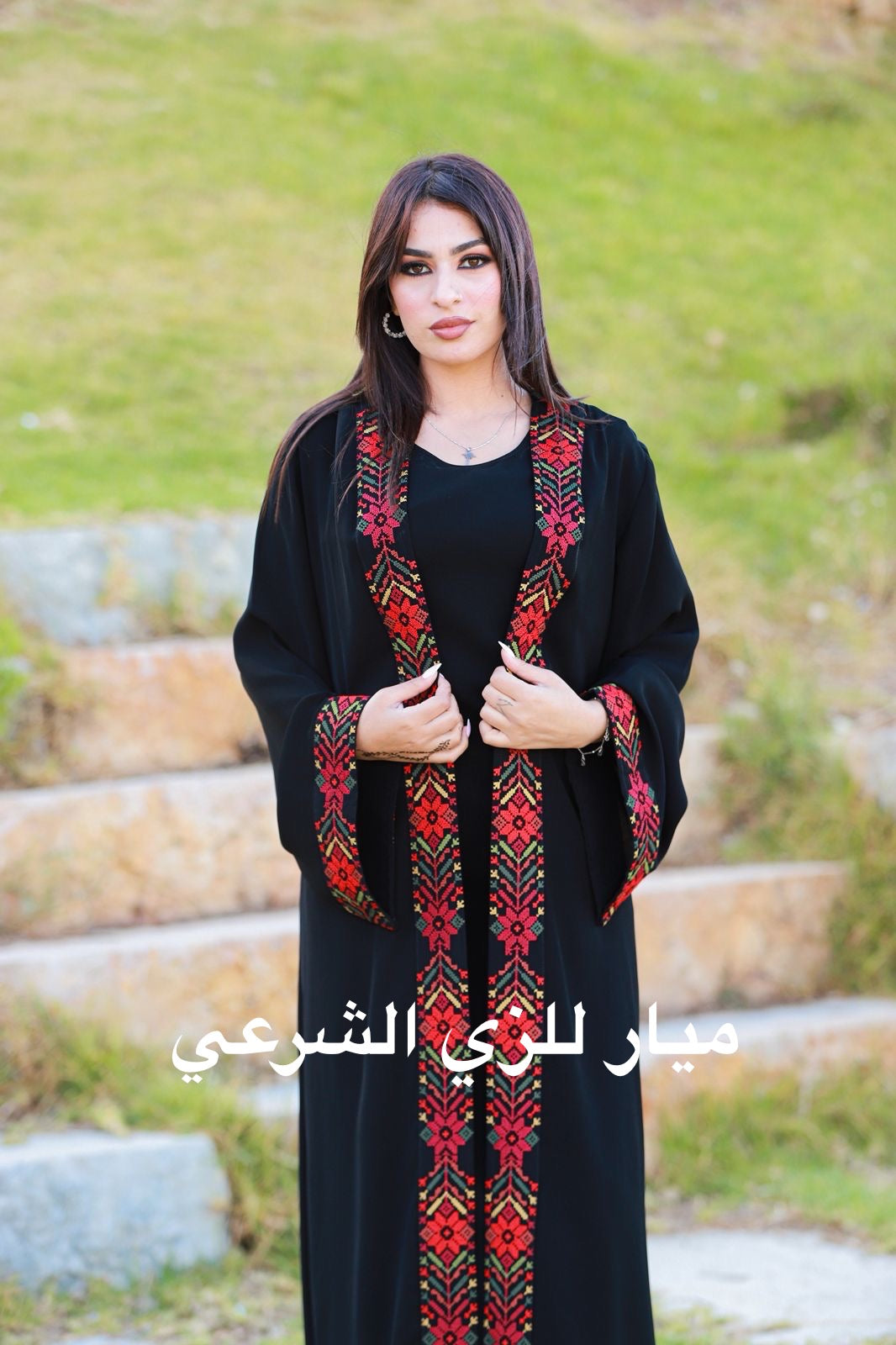 Black open abaya with tatreez details.