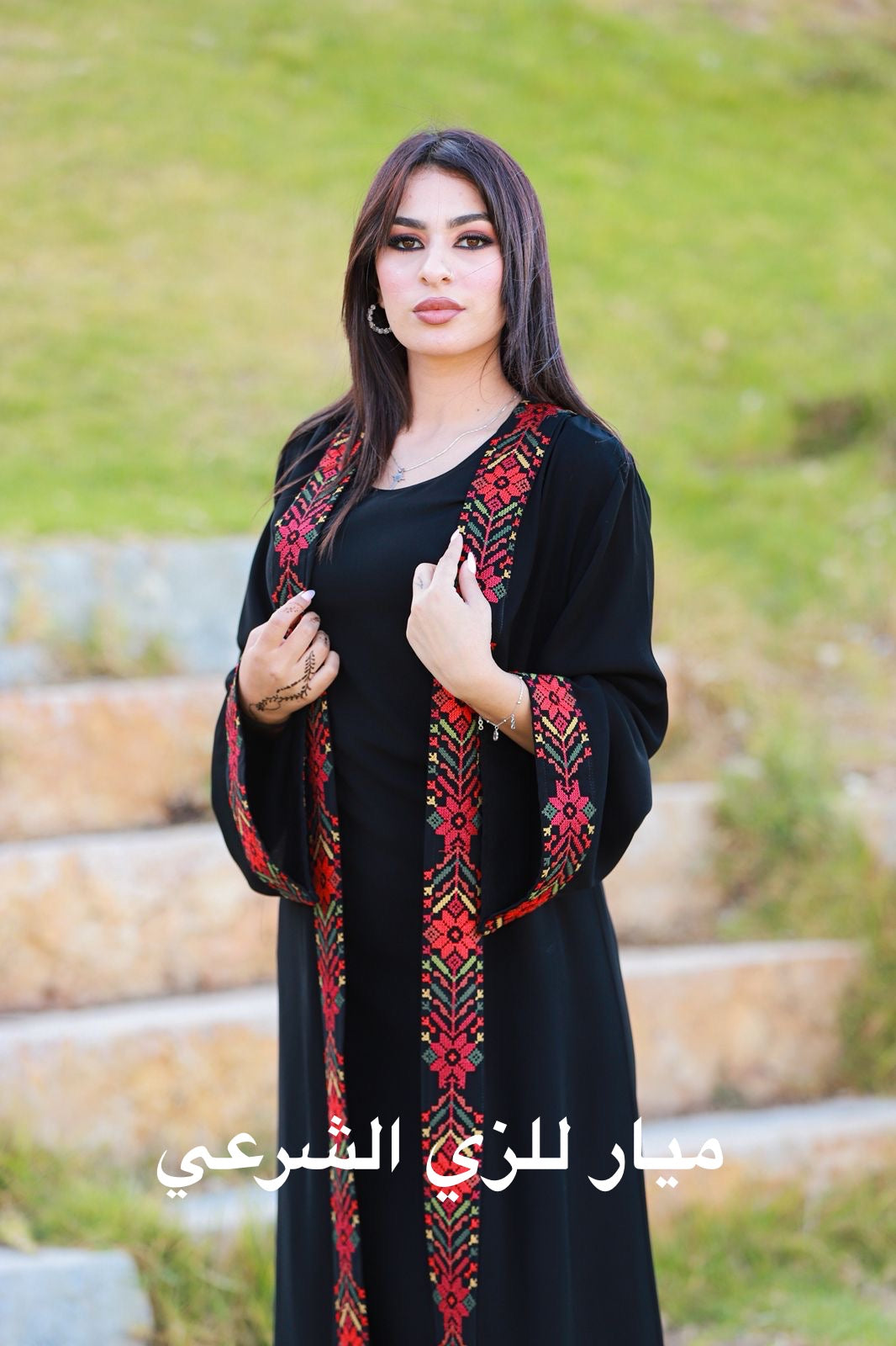 Black open abaya with tatreez details.