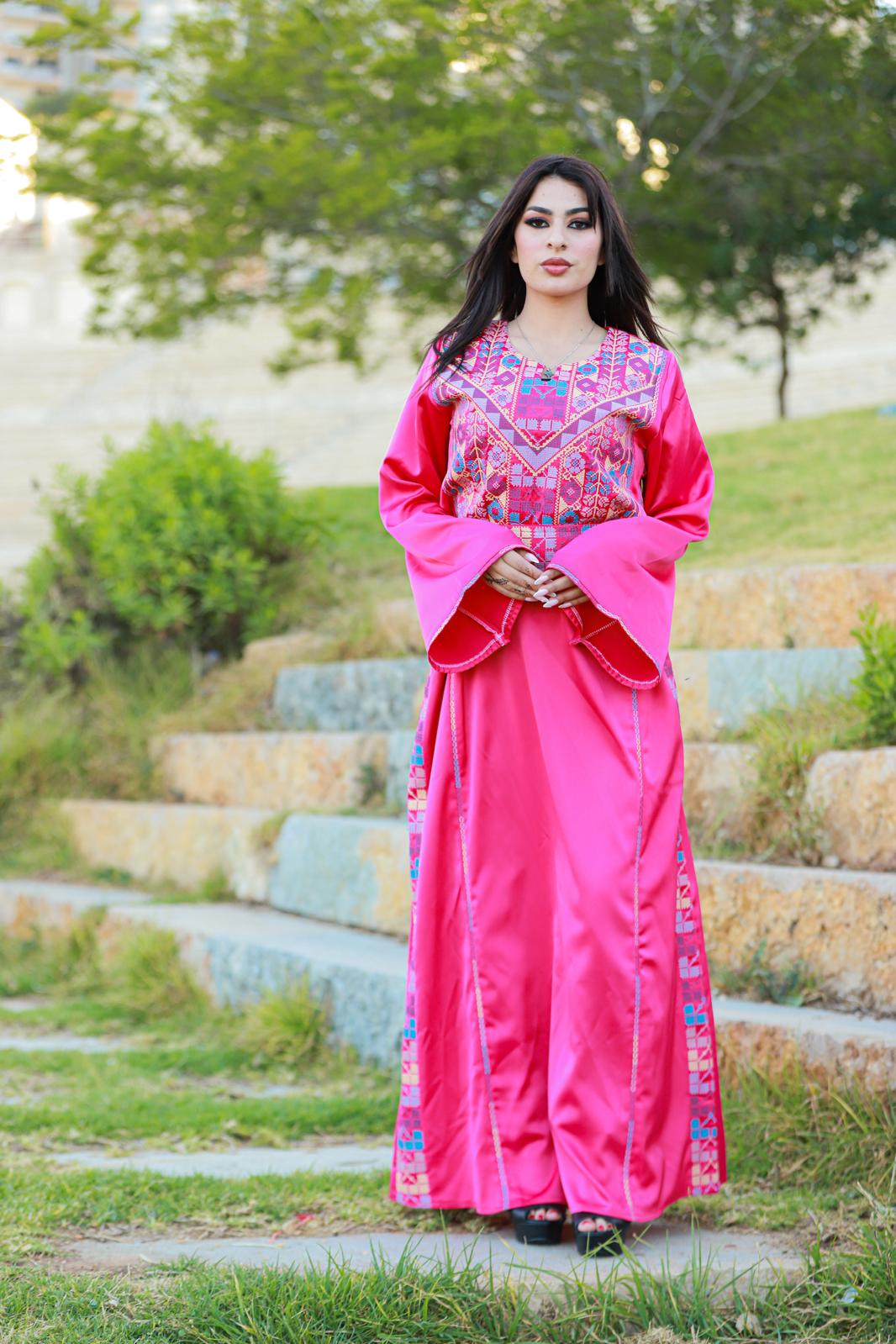 Pink thobe with tatreez details.