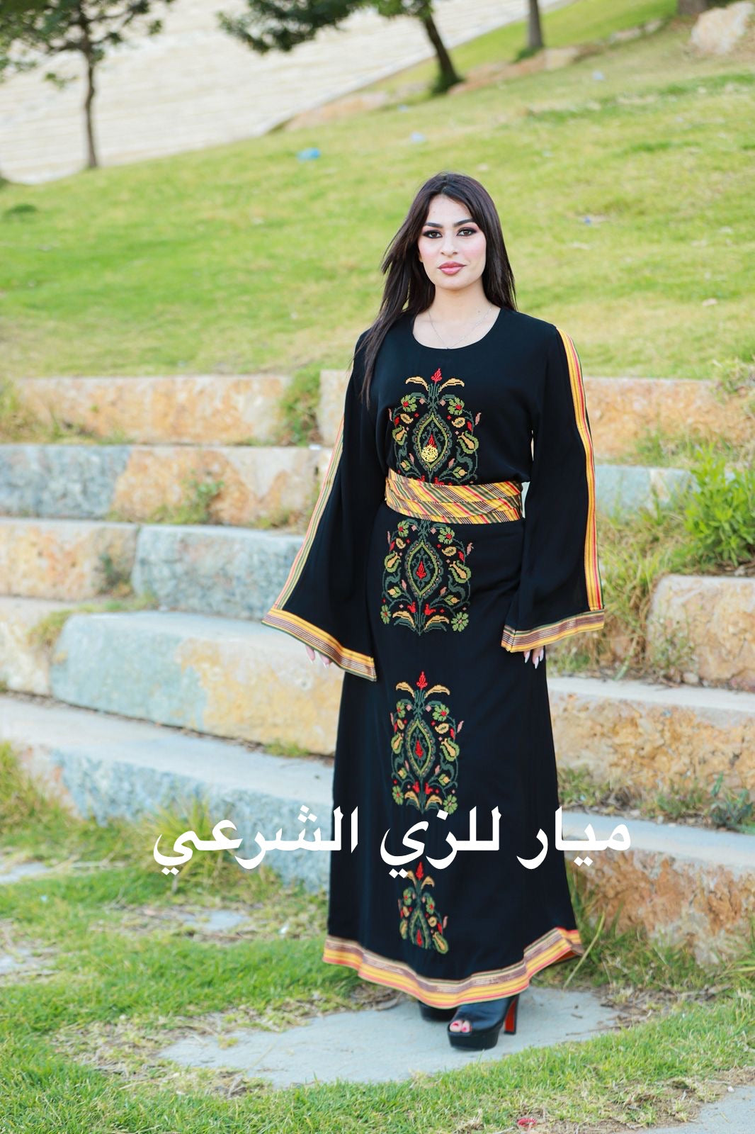 Black dress with tatreez details.