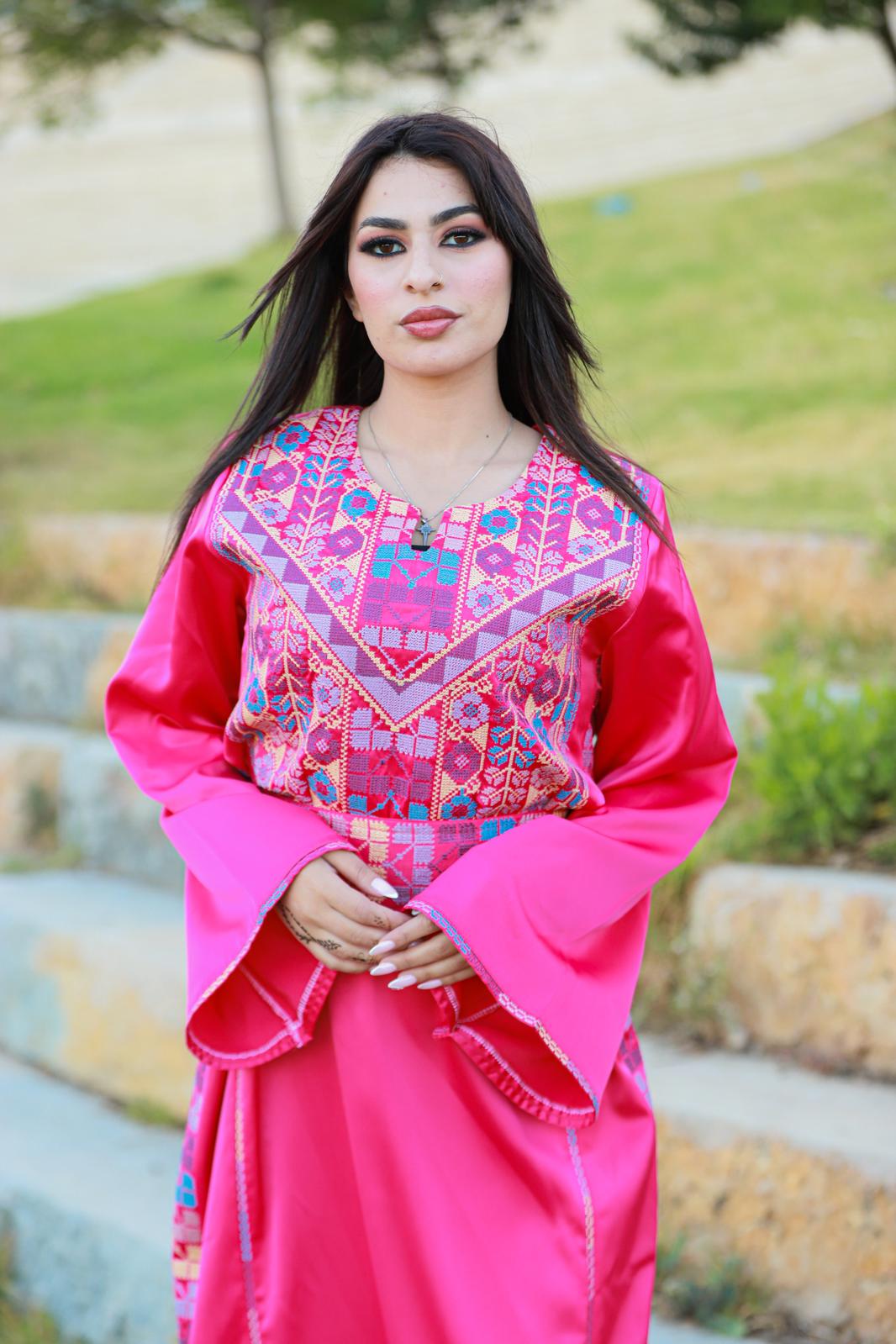 Pink thobe with tatreez details.