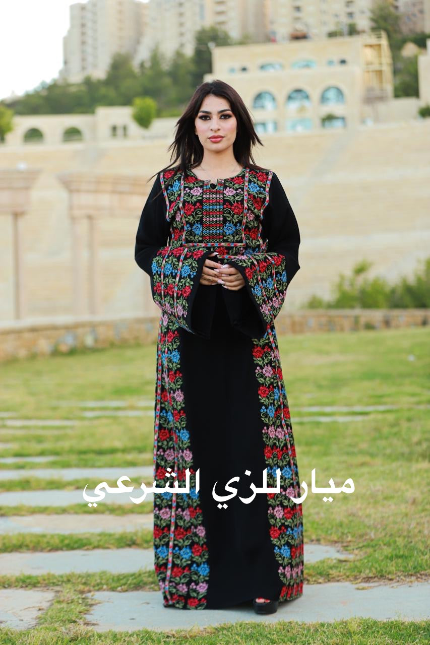 Black thobe with colorful tatreez details.