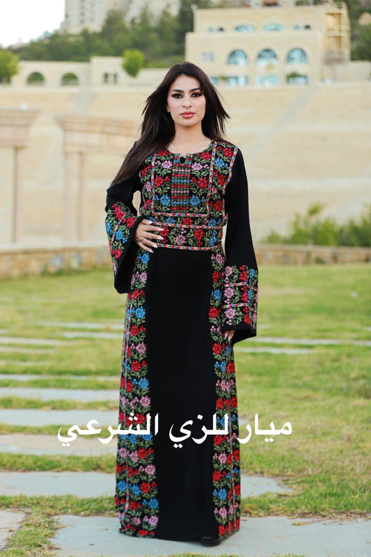 Black thobe with colorful tatreez details.