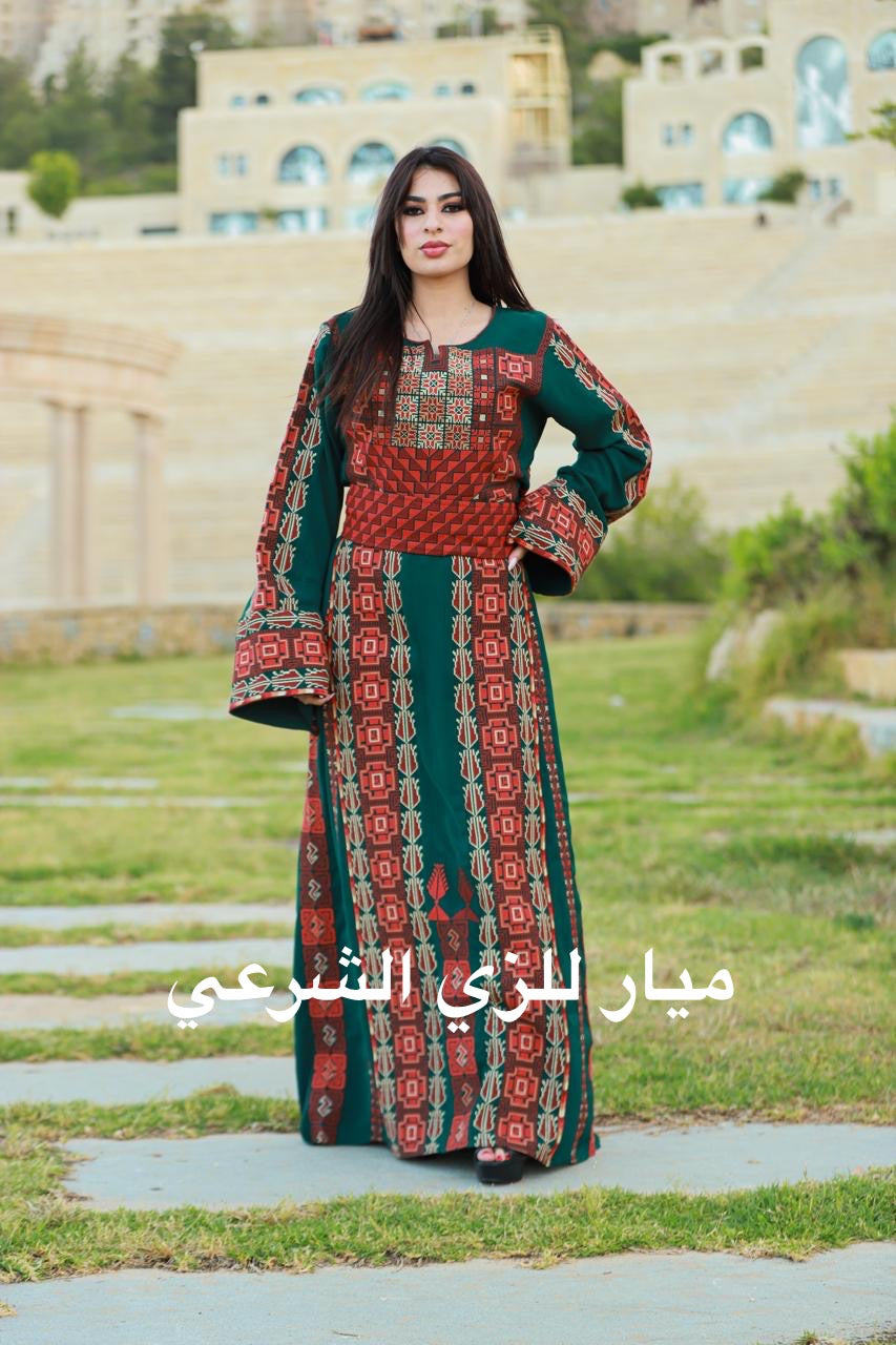 Green thobe with red and orange tatreez.