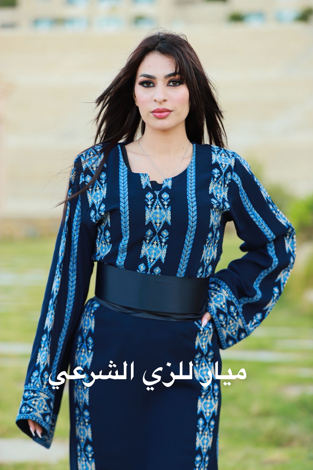 Navy blue dress with shades of blue tatreez.