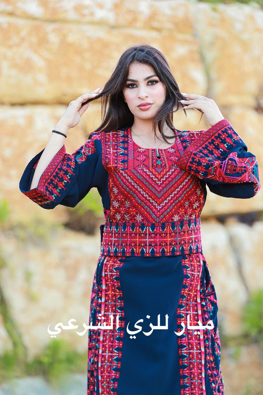 Navy blue thobe with red tatreez.