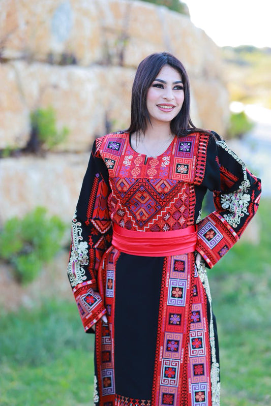 Black thobe with colorful tatreez.