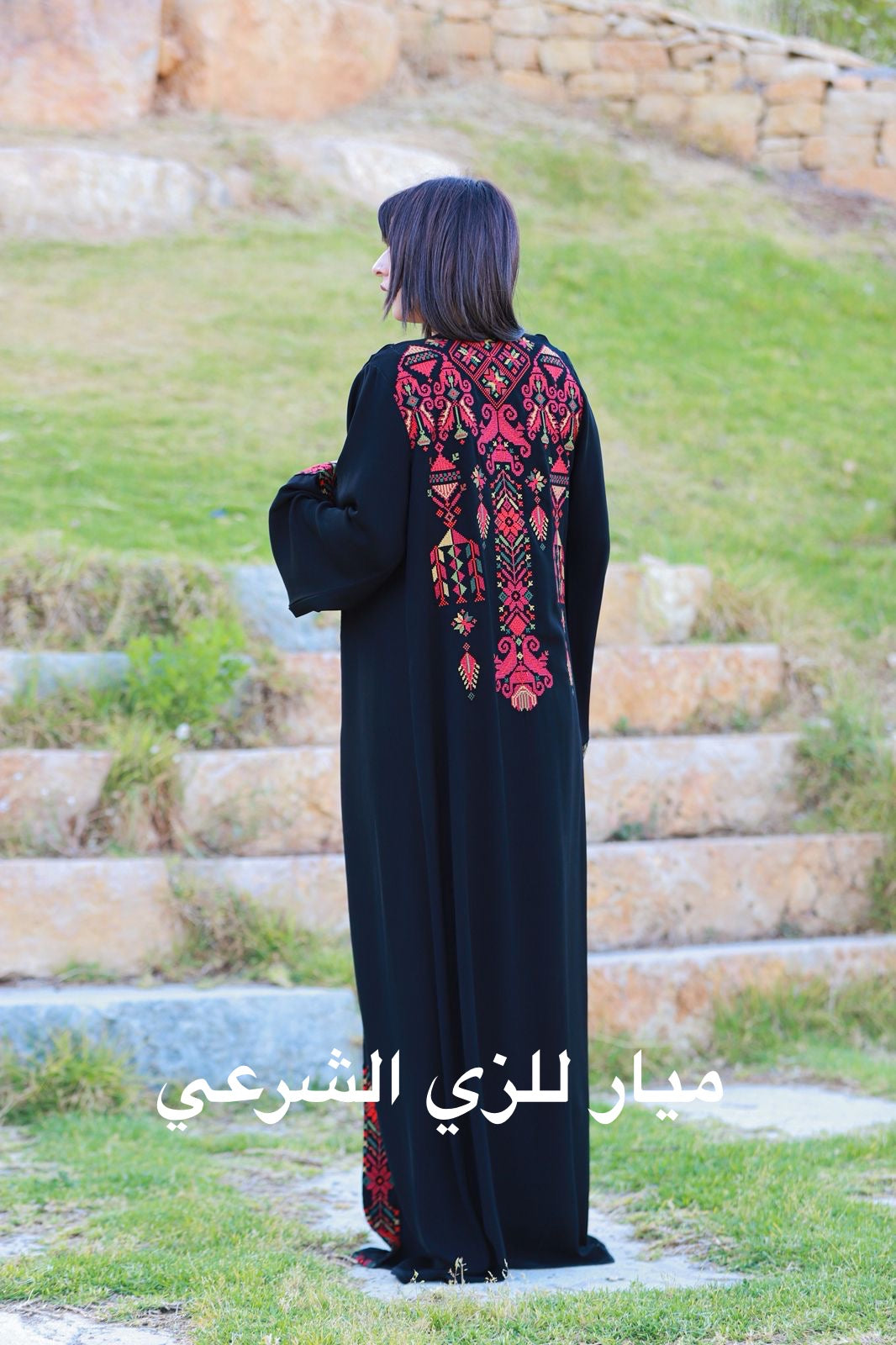 Black open abaya with tatreez details.