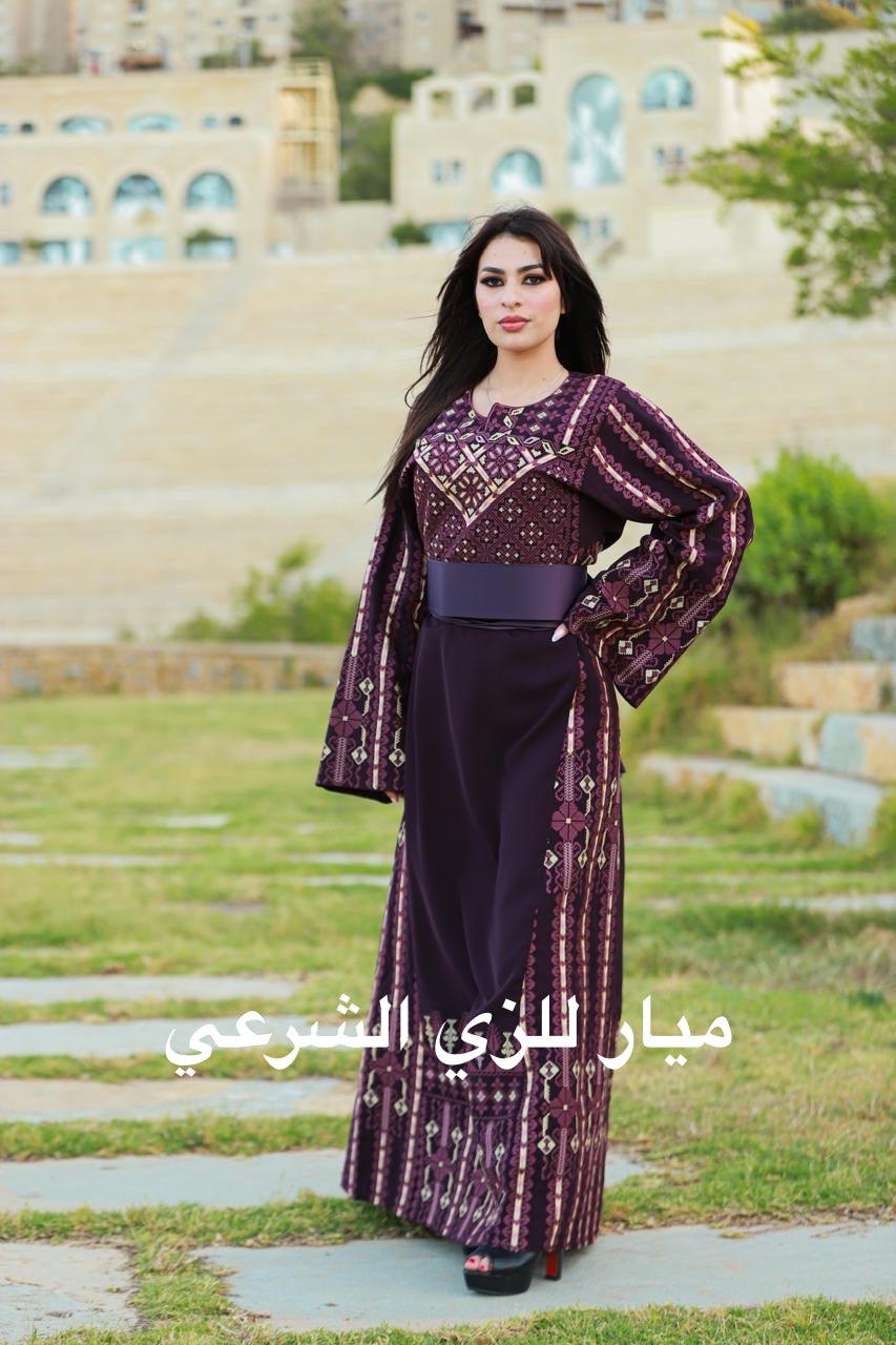 Purple thobe with tatreez.