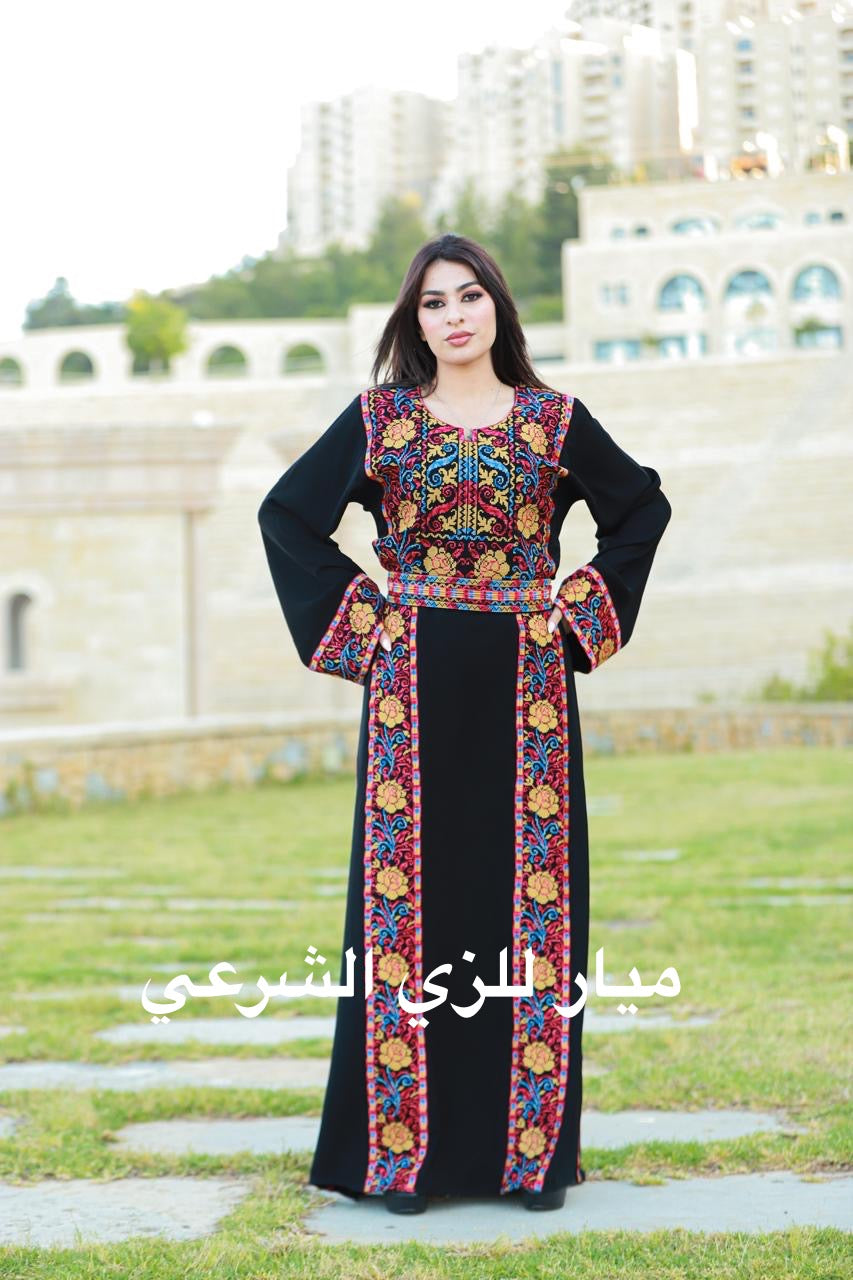 Black thobe with colorful tatreez details.