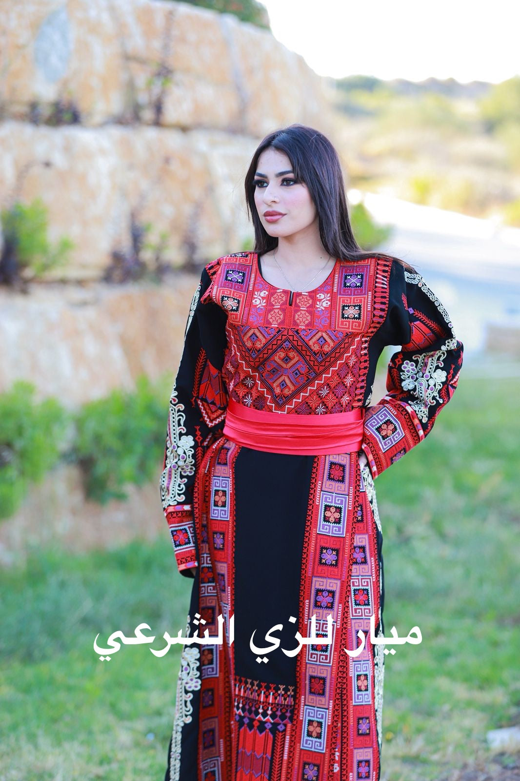 Black thobe with colorful tatreez.