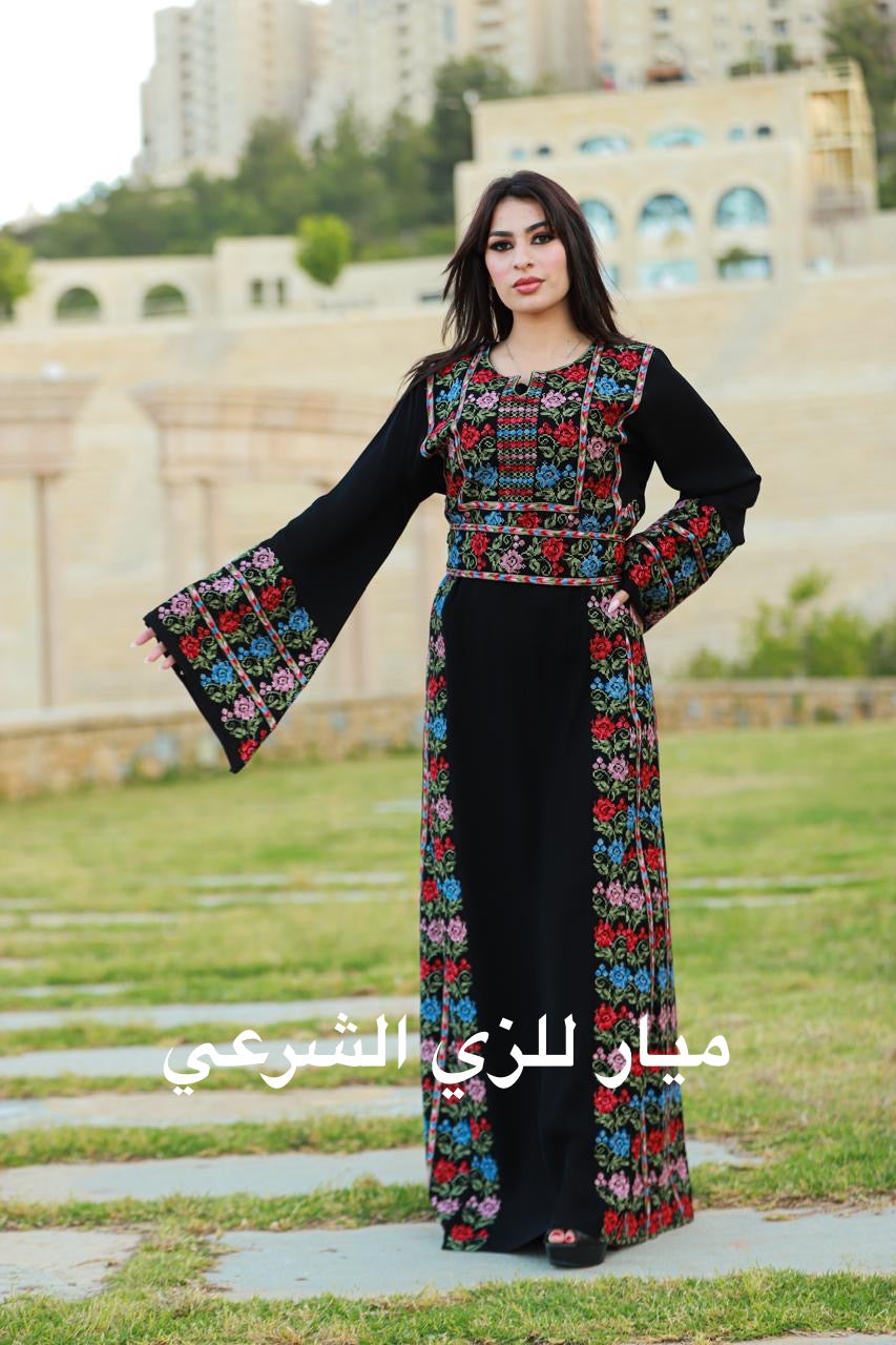 Black thobe with colorful tatreez details.