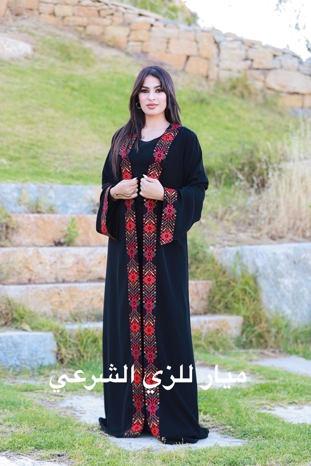Black open abaya with tatreez details.