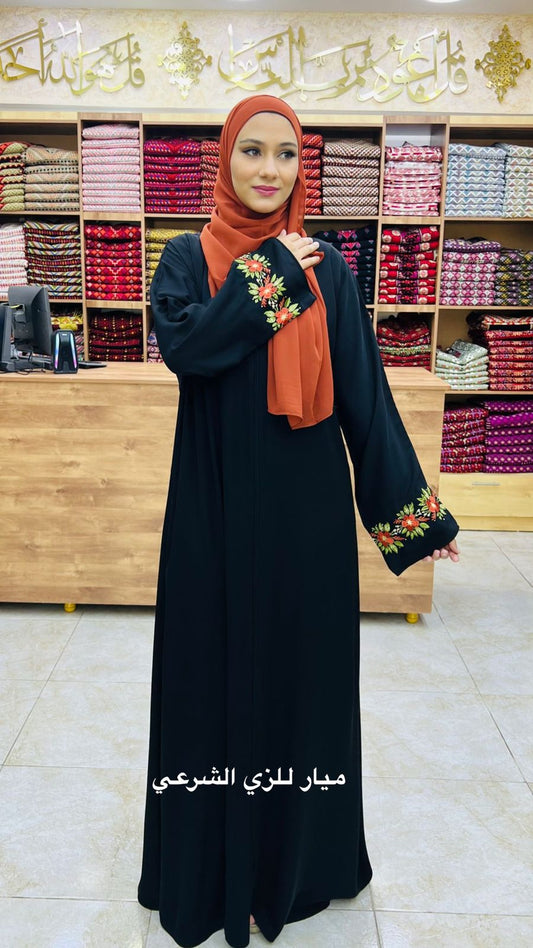 Black abaya with cute orange flowers details on the sleeve.