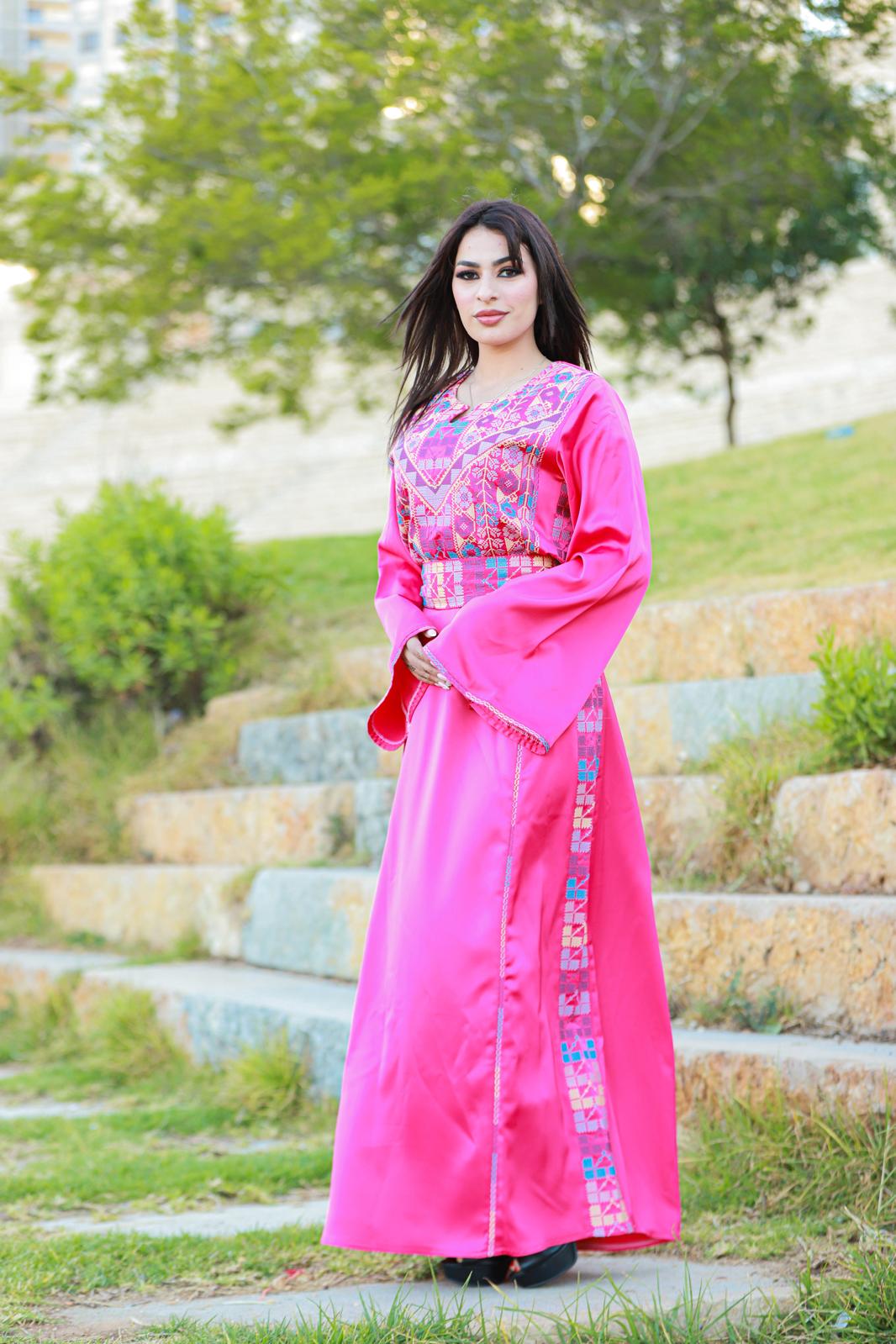 Pink thobe with tatreez details.