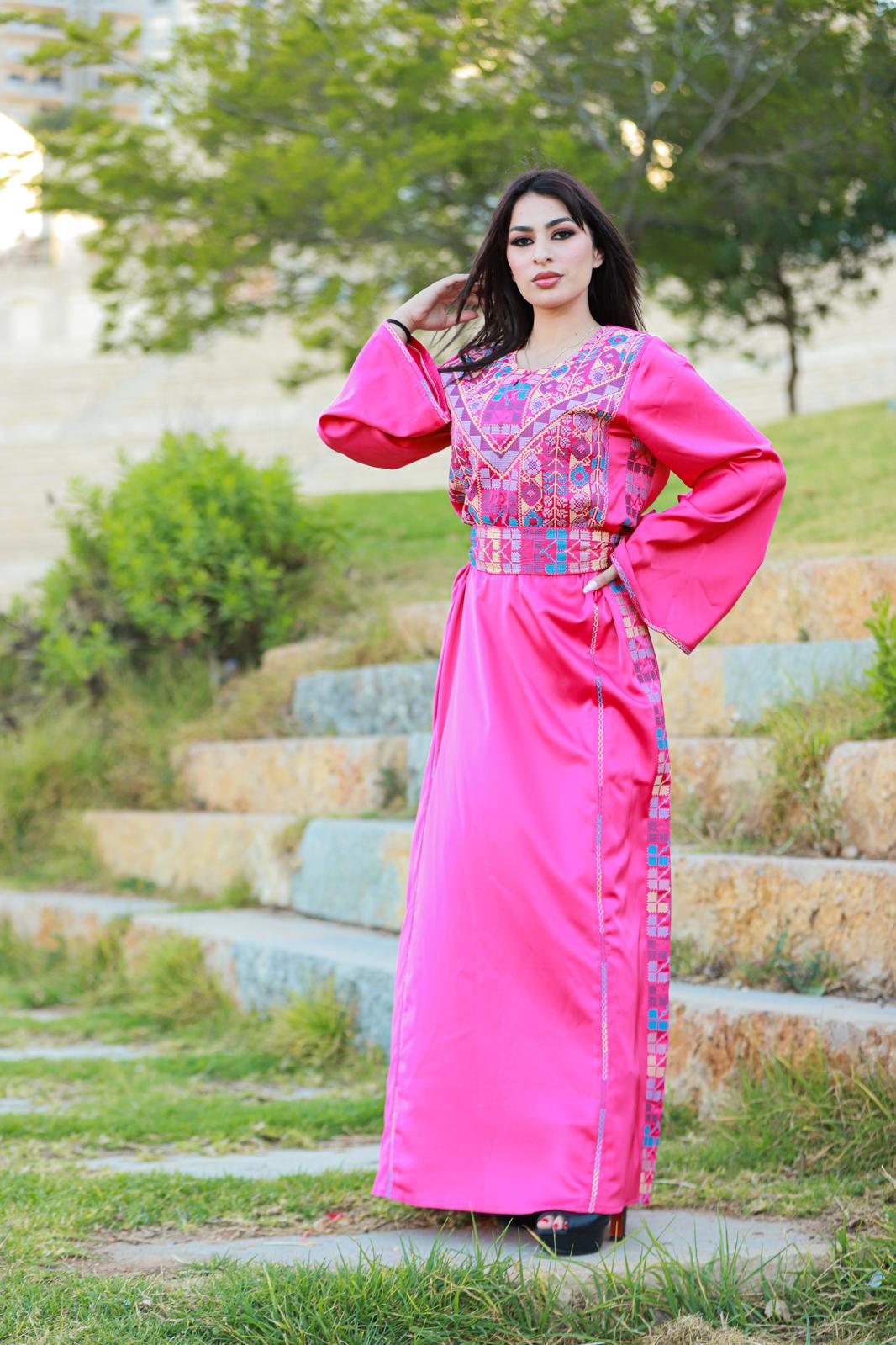 Pink thobe with tatreez details.