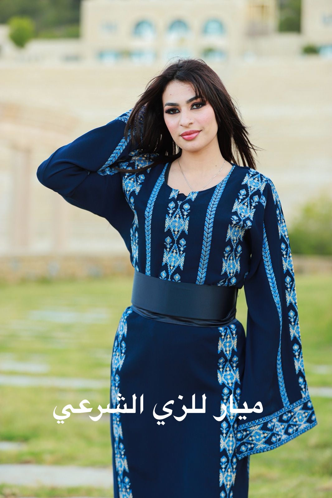 Navy blue dress with shades of blue tatreez.
