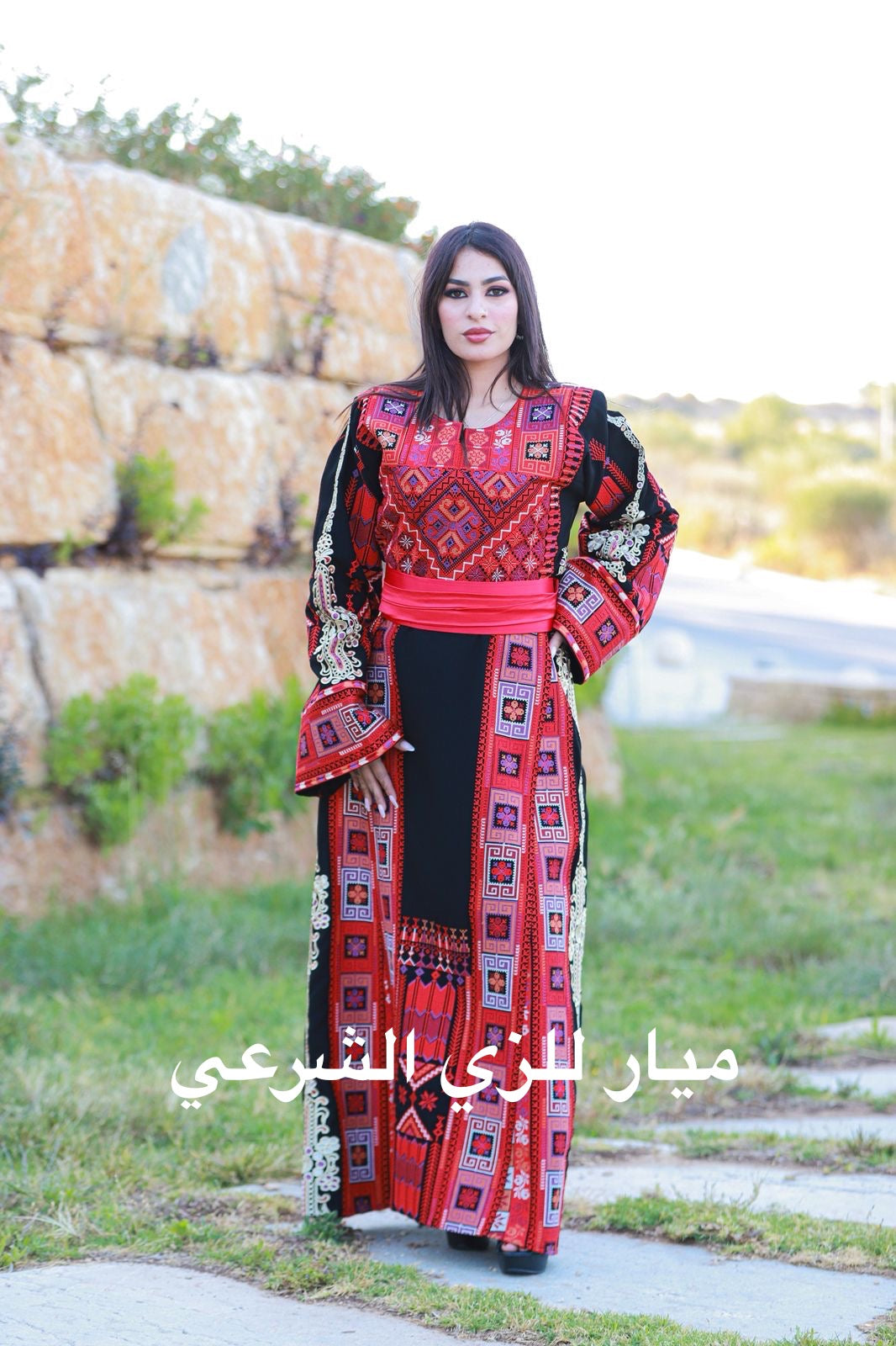 Black thobe with colorful tatreez.